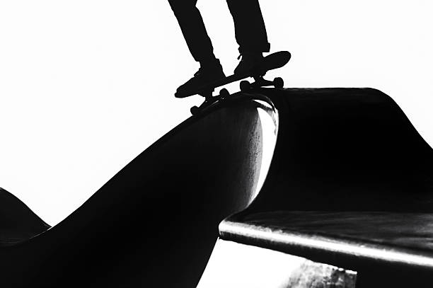 Venice Beach, CA - September 30, 2020 - Close up lack and white image capturing candid, dynamic skateboarding action in silhouette at the iconic Venice Beach Skatepark