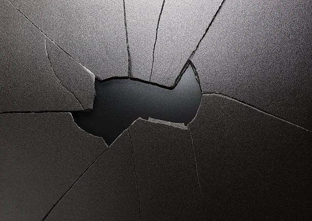 Broken hole in black ground with copy space for your text.