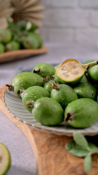 istock Fresh Feijoa Fruit on a Plate with a Golden Spoon 2241505453