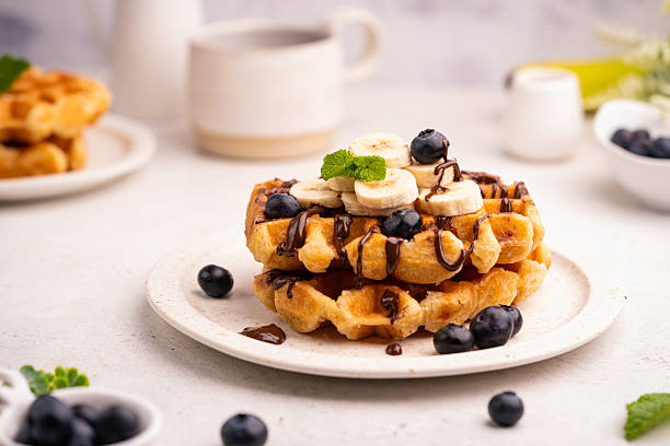 istock Tasty Belgian waffles with fresh berries 2241509602