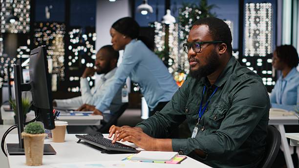 istock African american advisor extracting data by hand on a notebook late at night 2241511704