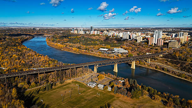 istock Aerial river bend and urban skyline in fall 2241512534