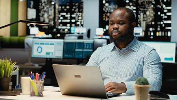 istock Black person proofreading and fact checking financial numbers 2241512650
