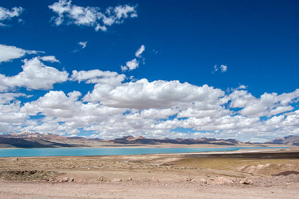 istock Vast Landscape with Blue Sky and White Clouds Over a Lake 2241516003