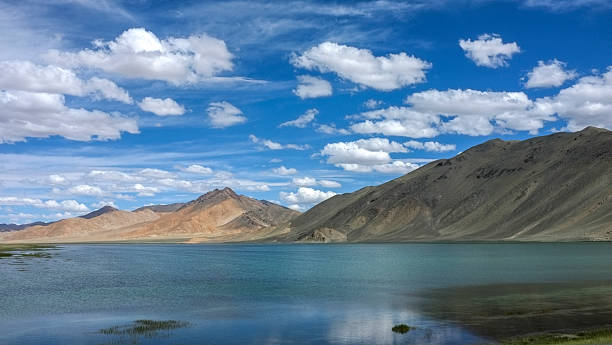 istock Picturesque landscape with a clear lake under a blue sky 2241516204