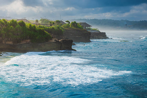 istock Tropical coastline with ocean and cloudy sky with sun light 2241518576