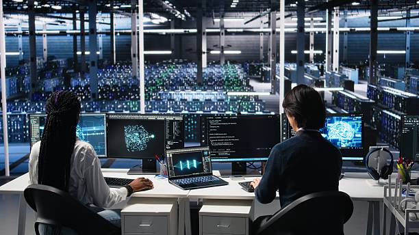 istock Delighted team in data center celebrating finishing neural network development 2241519897
