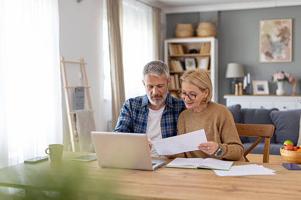 istock Couple Engaged in Work Together at Their Dining Table 2241521202