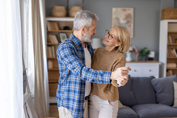 istock Couple smiles while embracing during a sweet dance moment. 2241521206