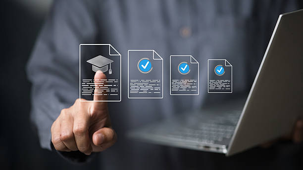 Businessman using laptop to validate online education certificates, digital learning verification concept