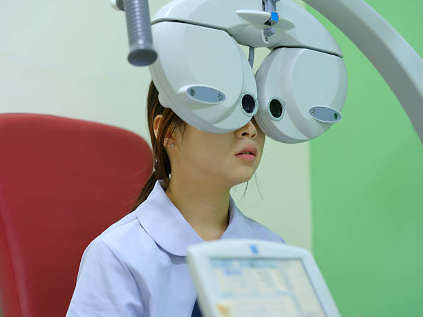 istock A young lady is undergoing an eye exam 2241524350