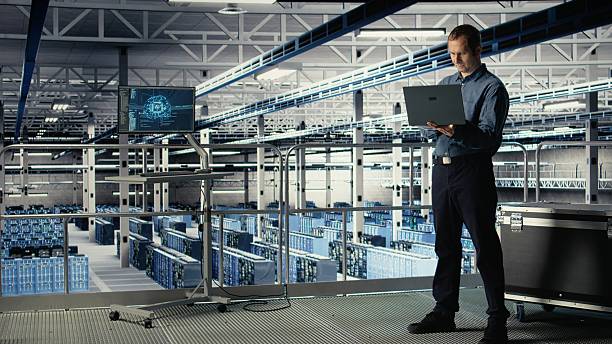 istock Data center admin on industrial platform checks AI dashboard using laptop 2241524453