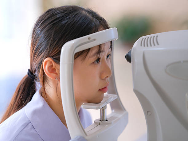 istock A young lady is undergoing an eye exam 2241524604