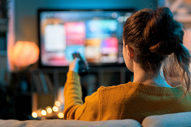 istock woman watching TV at home 2241525817