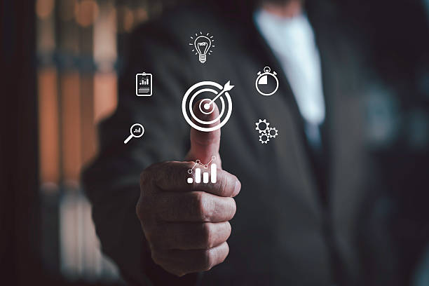 istock Businessman pointing at digital target icon with data analytics, innovation, and productivity symbols, representing business strategy, goal achievement, and technology success concept. 2241531965