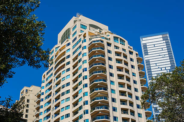 istock Tall modern residential building under a blue sky 2241533450