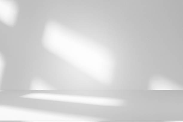 istock Wall interior background, studio and backdrops show products.with shadow from window color white . background for text insertion and presentation product 2241533547