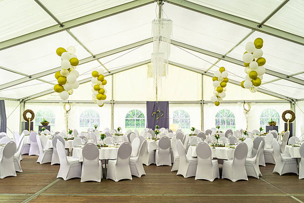 istock White tables stand in perfect symmetry. 2241535968