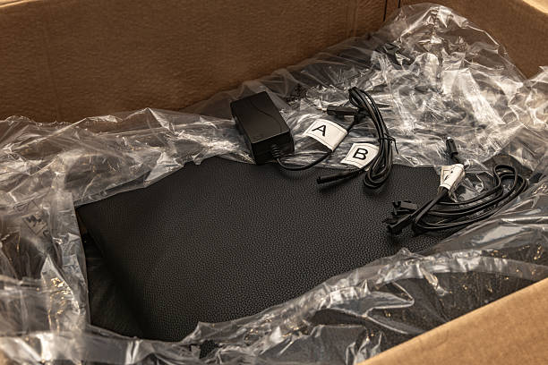 istock Power cables and control components are placed on one of the chairs, suggesting the process of installation or setup after delivery. 2241540885
