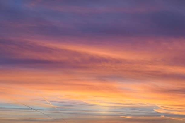 Stunning golden hues beautifully illuminate the sky above a peaceful mountain silhouette during the sunset hour