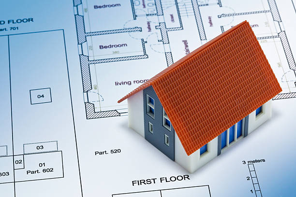 istock Building Permit concept with imaginary building approvation and residential home model 2241542875