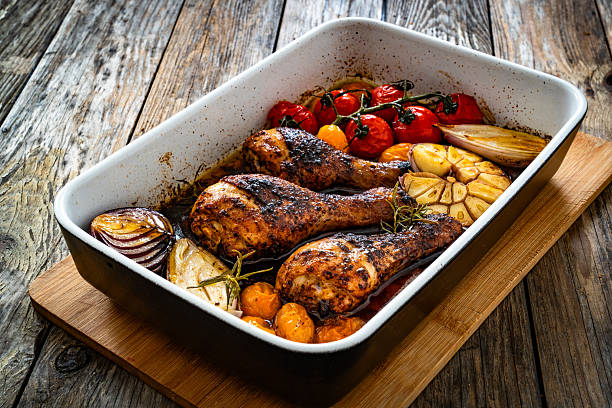 Chicken thighs roasted in the oven with beer, potatoes, onion and spices