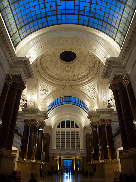istock Grand Hall Dome Interior, Brussels Exchange - Low-angle view of the domed, ornate ceiling and columns inside the historic Bourse (Exchange) building in Brussels, Belgium. 2241550846