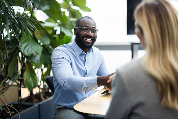 istock Diverse business professionals shaking hands at office meeting 2241552949