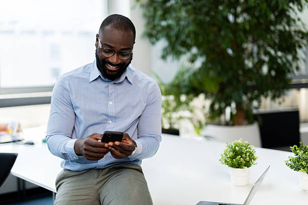 istock African american businessman using smartphone in office 2241554420