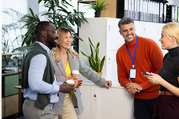 istock Diverse business people communicating during coffee break at office 2241554442