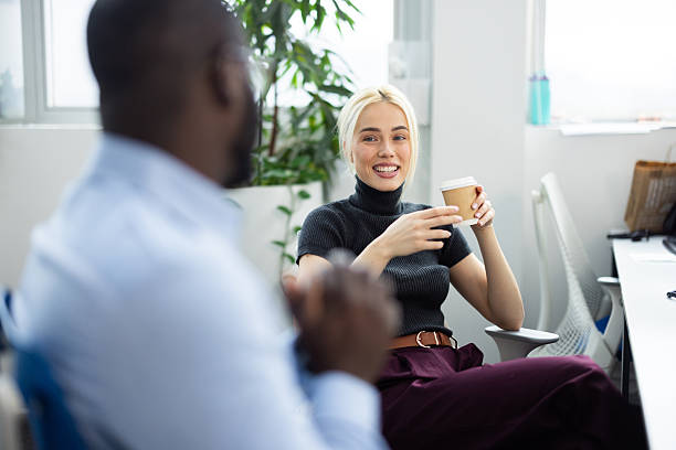 istock Business colleagues having coffee break in the office 2241554469