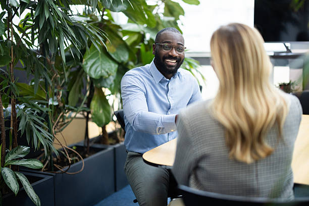 istock Colleagues smiling and talking during a business meeting in office 2241554600