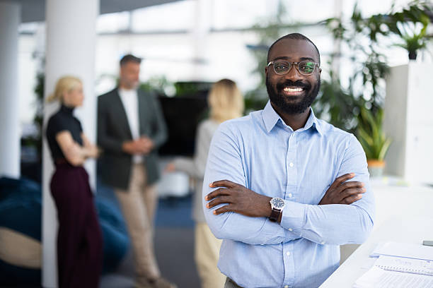 istock Happy black businessman smiling at the office 2241554632
