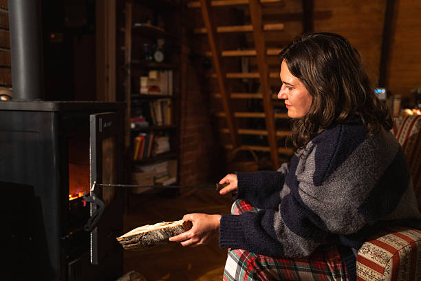 istock A woman uses the stove 2241555133