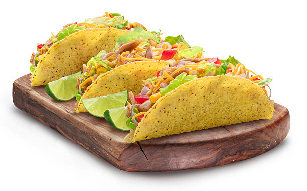 istock Mexican chicken meat taco, corn-based tortilla with chicken meat and diced fresh vegetables filling isolated on white. File contains clipping path. 2241555221