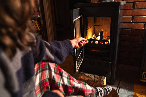 istock A woman uses the stove 2241555527
