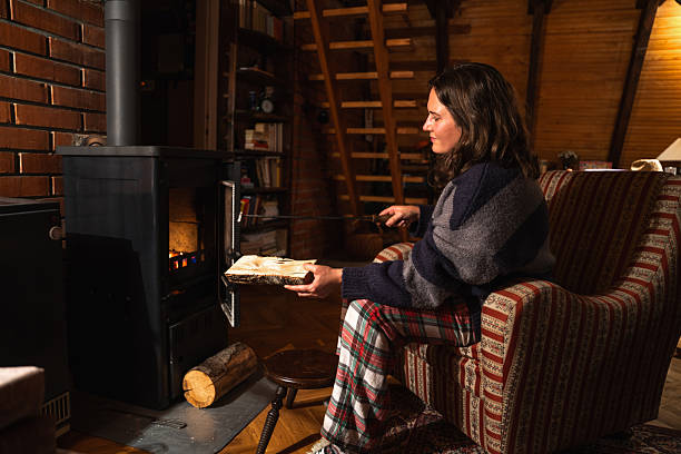 istock A woman uses the stove 2241556681