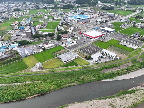 istock A city with a river running through it and a large building in the middle 2241562860