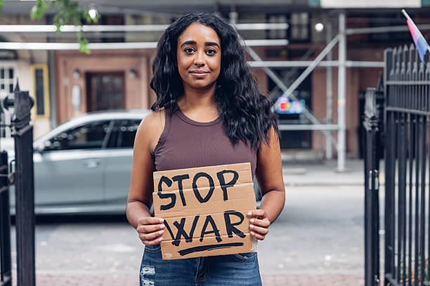 istock Activist holding stop war sign 2241563322