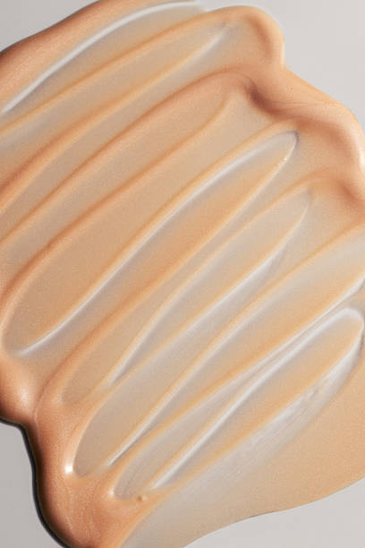 istock Beige foundation or primer texture swatch, minimal clean composition, glowing and smooth surface. 2241563660