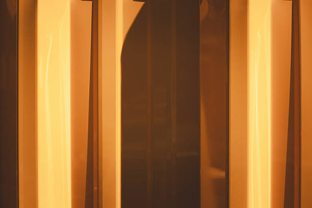 istock Golden metal panel with light and shadow abstract background 2241565158