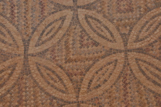 istock Ancient mosaic floor design featuring geometric patterns and earthy tones in a historical site 2241569345