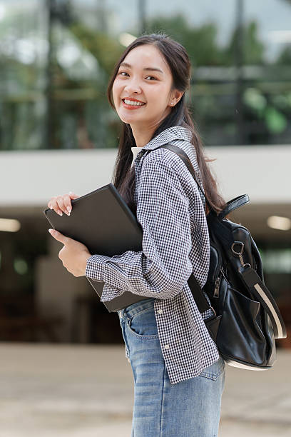 istock Young asian woman student smiling on university campus 2241569983
