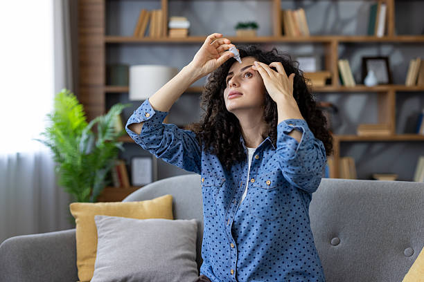 istock Woman applying eye drops for treating dry eyes 2241571495