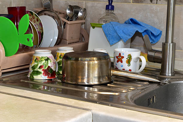 istock Clean dishes dry on the sink. 2241574187