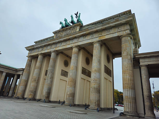 istock The Brandenburg Gate, a monumental city gate and landmark with Doric columns and a quadriga under a cloudy sky, government district in 10117 Berlin, Germany 2241574478