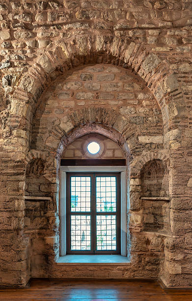 istock Ancient stone wall and arched window, Istanbul, Turkey. 2241575303
