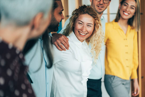 istock Cheerful team huddle in the office 2241575530