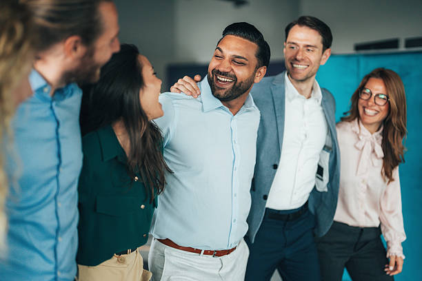 istock Cheerful team huddle in the office 2241575538