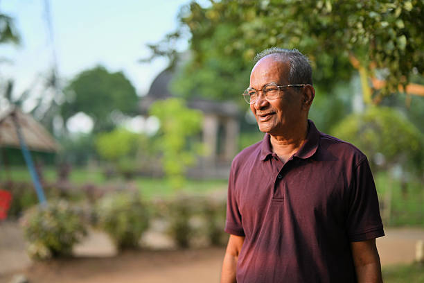 istock Senior man enjoying an evening Walk in the Park 2241575601